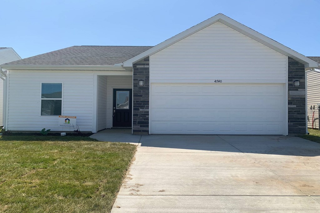 a white house with a gray roof